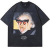 The Vexlly Vintage Men T-Shirt offers a humorous and eye-catching graphic print of a person wearing sunglasses, with an expressive face being playfully stretched by two hands and enhanced with a layered collage effect for added depth. This black washed tee boasts an oversized, loose fit, embodying streetwear, hip hop, with its cotton fabric.