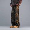 A person wearing Vexlly's Leopard Print Jeans, a retro wide-leg streetwear option in an Asian size, pairs them with a dark hoodie and beige shoes, standing with hands in pockets against a plain gray background.