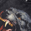 A close-up of a Vintage Black T-shirt by Vexlly highlights a bold, snarling Rottweiler dog graphic, featuring sharp teeth and intense eyes against a dark background. Ideal for those who appreciate striking designs, the Beast Rottweiler Dog Graphic 