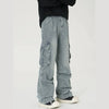 A person dressed in Y2K streetwear is wearing Vexlly's 2023 Ropa ink painting baggy jeans cargo pants, featuring large side pockets for a relaxed, casual look. They pair these vintage blue pleated denim trousers with a black sweater and black-and-white sneakers while standing in a neutral, light-colored space.