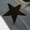 A detailed shot of the My Store vintage denim oversized hoodie reveals a prominent large black star patch with a beige outline. The denim’s slightly worn texture adds to its casual and stylish charm, perfect for an autumn hip hop streetwear look.