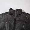 Here's a close-up of the Elemental Black Streetwear Coat by Vexlly. This hip hop jacket boasts a high collar and is adorned with multiple zippers and star-shaped metal rivets, capturing the essence of men's fashion. Its textured finish adds a rugged touch, making it ideal for those looking to embrace an edgy style.