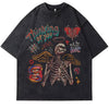 The Vexlly Romantic Grunge Graffiti Skeleton Graphic Tee is a vintage black t-shirt adorned with vibrant grunge graffiti-style art. It features a skeleton with wings, hearts, faces, and the phrases "Thinking of you" and "all you need is live." The design also includes an array of symbols like stars, a peace sign, and abstract shapes.