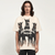 A person with long hair is seen wearing the Vexlly Trifecta Oversized Doberman Dog Graphic Tee. The shirt is beige and showcases three black Dobermans alongside bold text reading "Thoroughbred Represent." Embracing streetwear fashion, they stand against a minimalistic plain white background.