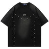 The Vexlly Punk Rivet T-shirt, in classic black, boasts short sleeves and a striking central design made of silver studs that create a geometric pattern. A small embroidered logo is discreetly positioned near the neckline. This casual and modern piece reflects a vintage oversized hip-hop streetwear aesthetic, with precise sizing ensured through hand measurements.